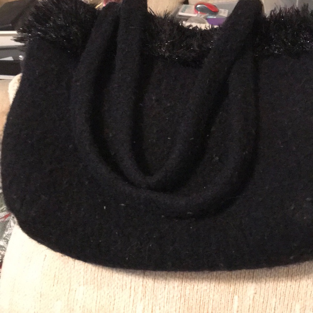 Boiled wool black purse with black eyelash trim.